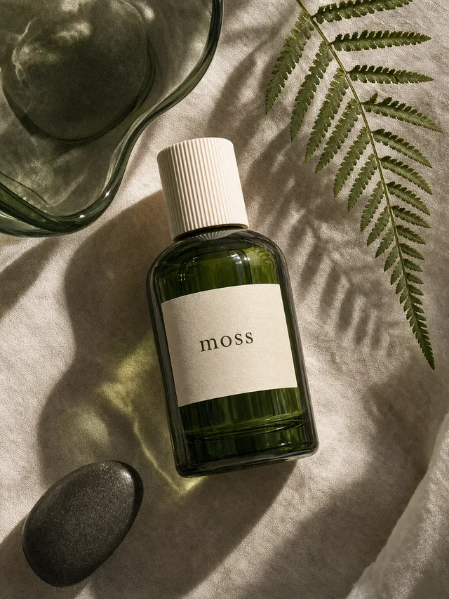 The same Moss bottle in an overhead botanical still life